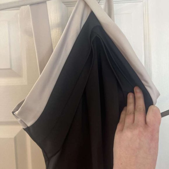 Black and white jumpsuit.  Classy, elegant neckline.  Size small - Picture 3 of 7